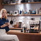 De'Longhi EC9155.MB barista kit contents: professional tamper, tamping mat, dosing and tamping guide, milk jug and filter baskets
